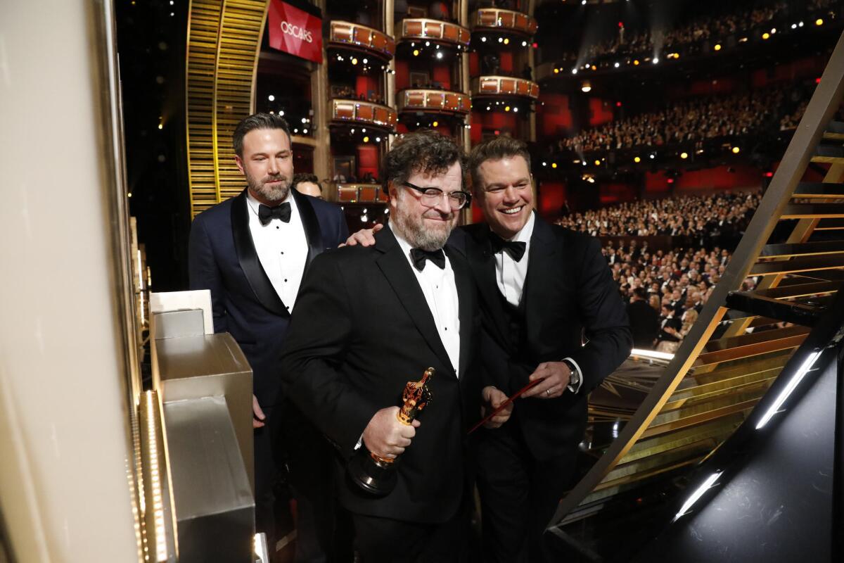 Ben Affleck and Matt Damon lead Kenneth Lonergan offstage upon winning the original screenplay Oscar for 'Manchester by the Sea.'