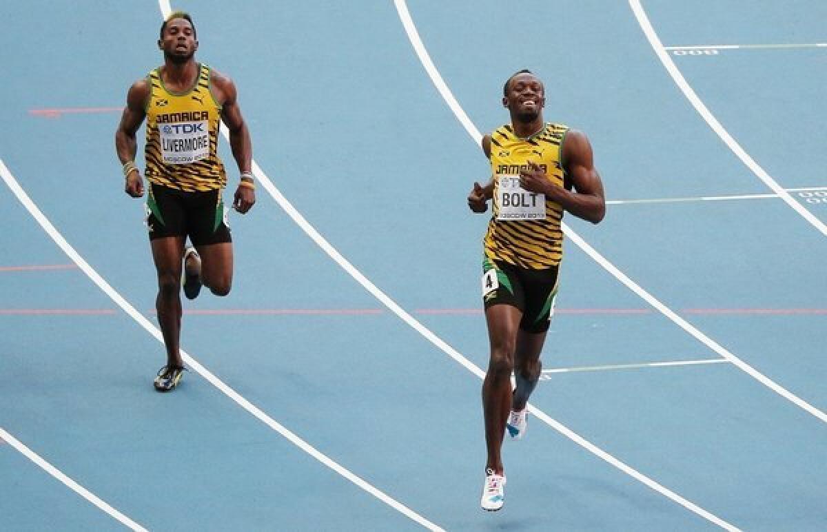 Usain Bolt leads the way in the 200-meter semifinals.