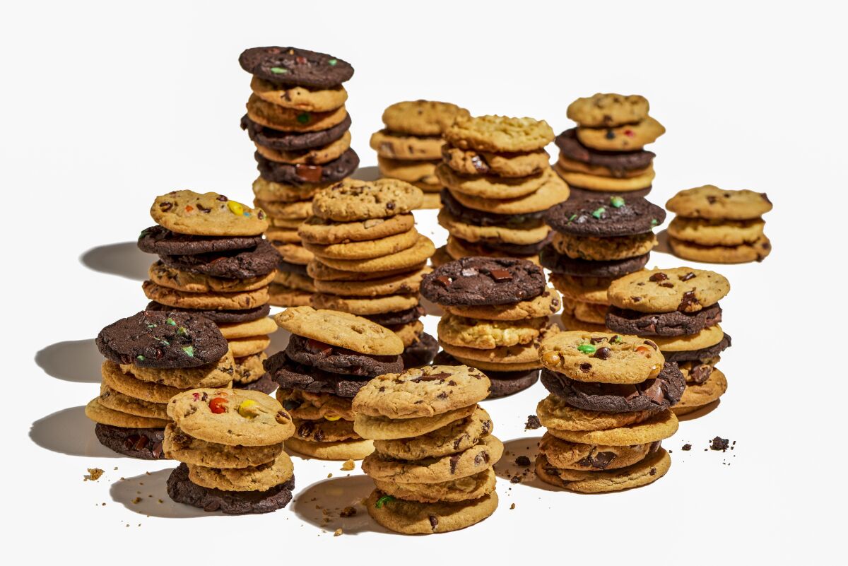 A photo of stacks of cookies from Insomnia Cookies against a white background.
