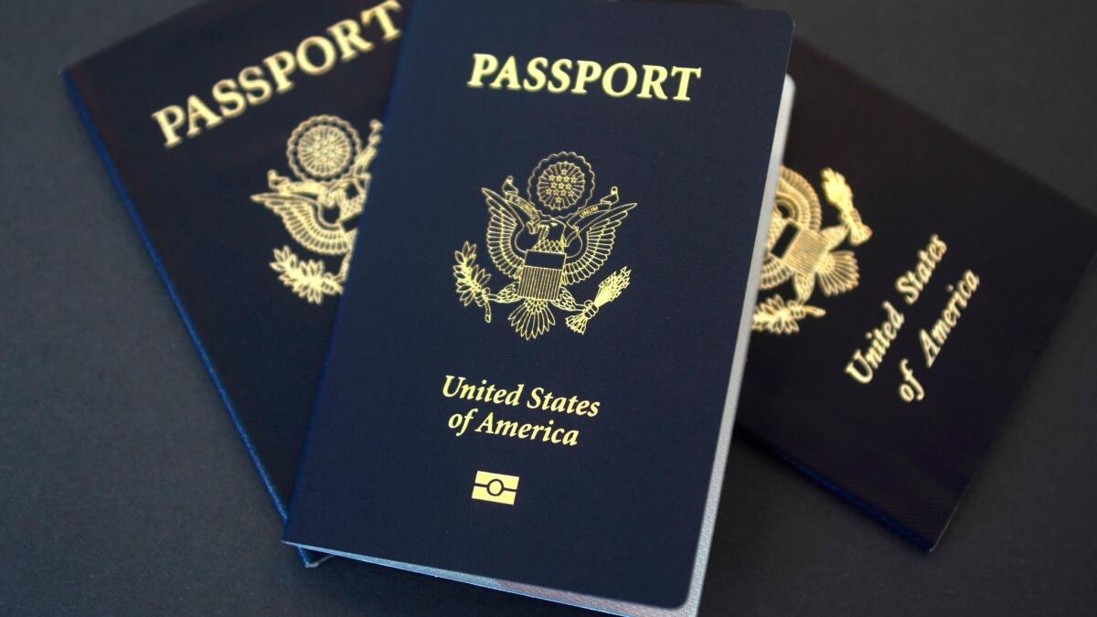 Three U.S. passports lie on a table 