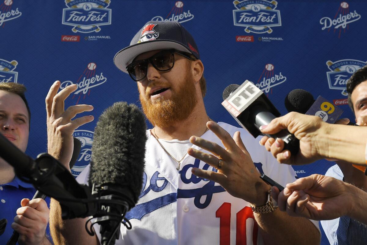 Dodgers third baseman Justin Turner is interviewed by reporters during Dodgers FanFest on Jan. 25, 2020, at Dodger Stadium.
