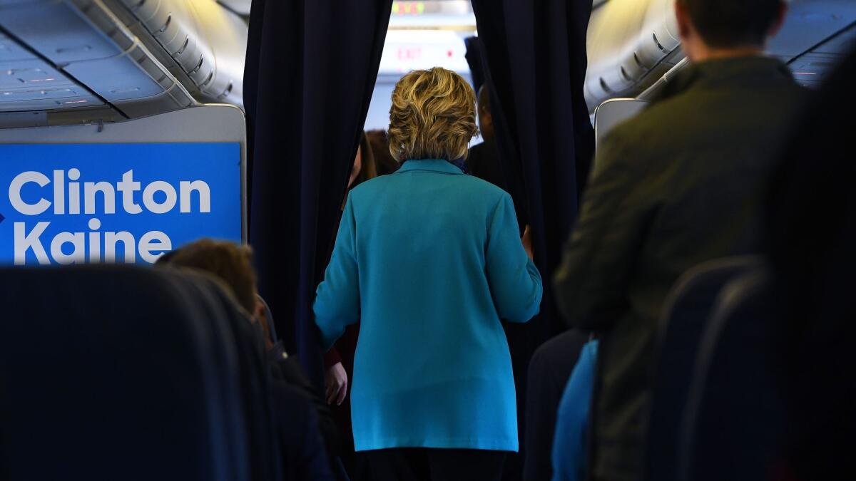 Hillary Clinton boards her plane on Saturday for a flight to Florida.