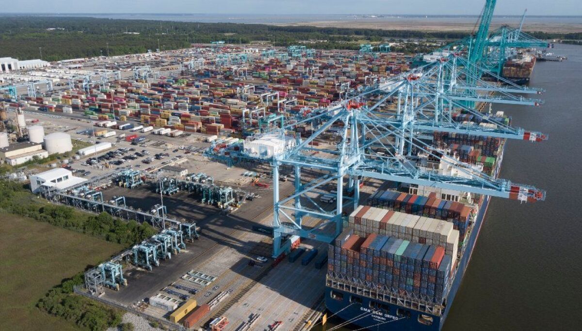 A container ship is unloaded at the Virginia International Gateway terminal in Norfolk on Friday. Many new shipments from China will face a 25% tariff imposed by President Trump.