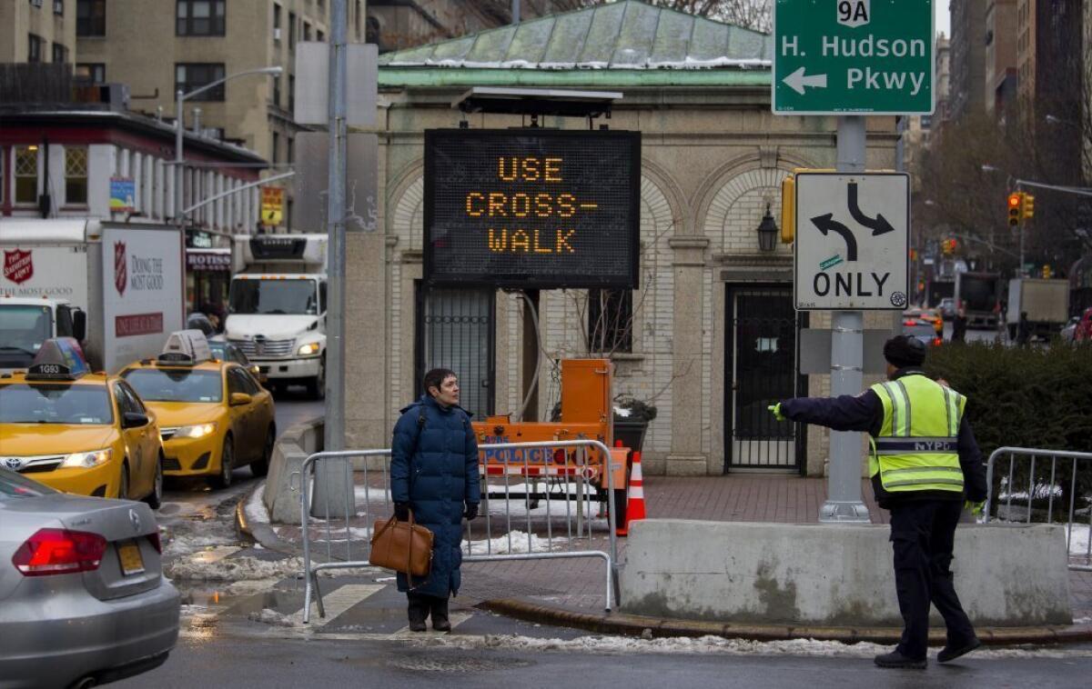 A pedestrian is directed to use a crosswalk at an Upper West Side intersection of Manhattan during a recent push to combat pedestrian deaths by cracking down on jaywalking.