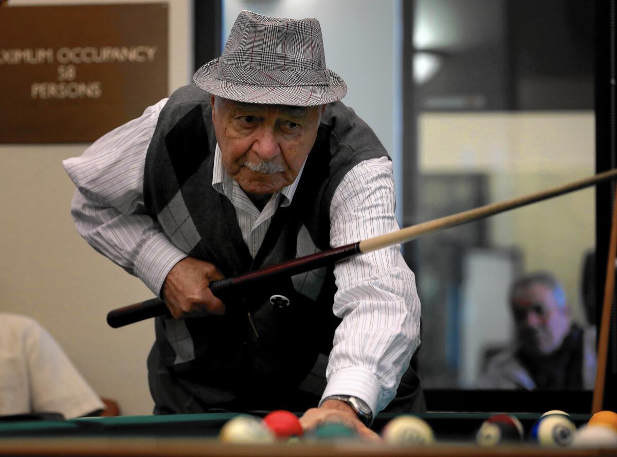 Sarkis Ohanessian, 87, plays pool at the Adult Recreation Center in Glendale.
