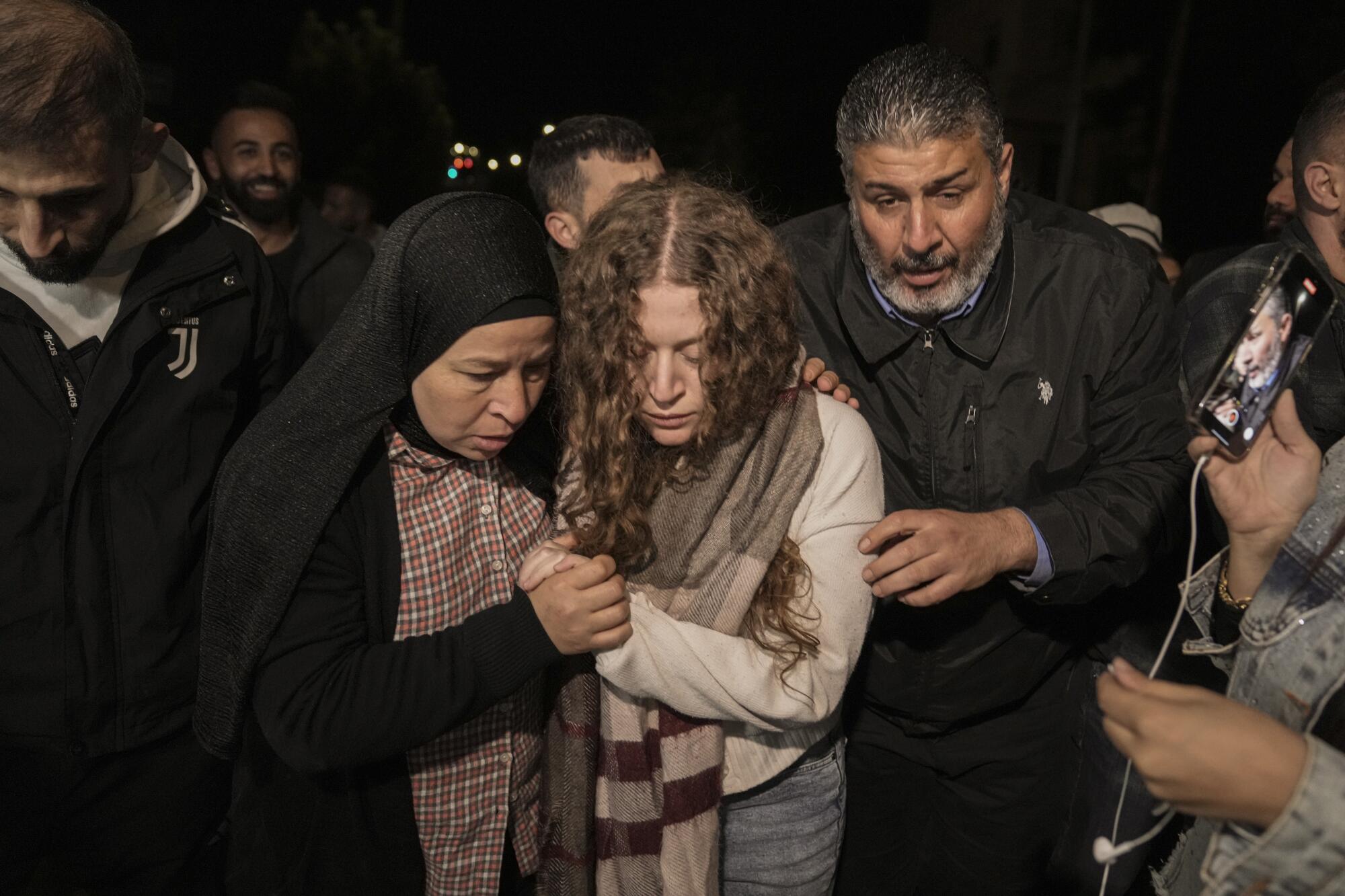 Palestinian woman being supported by her mother after her release from prison in Israel