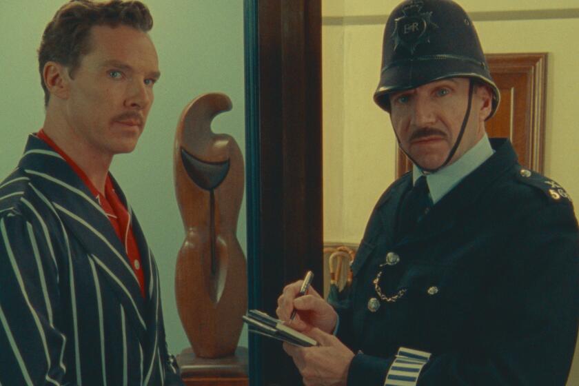 A man stands at his front door speaking to a police constable in a scene from the movie "The Wonderful Story of Henry Sugar."