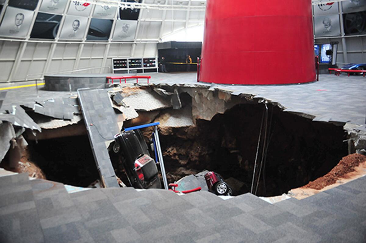 Several vehicles rest in a sinkhole at the National Corvette Museum in Bowling Green, Ky.