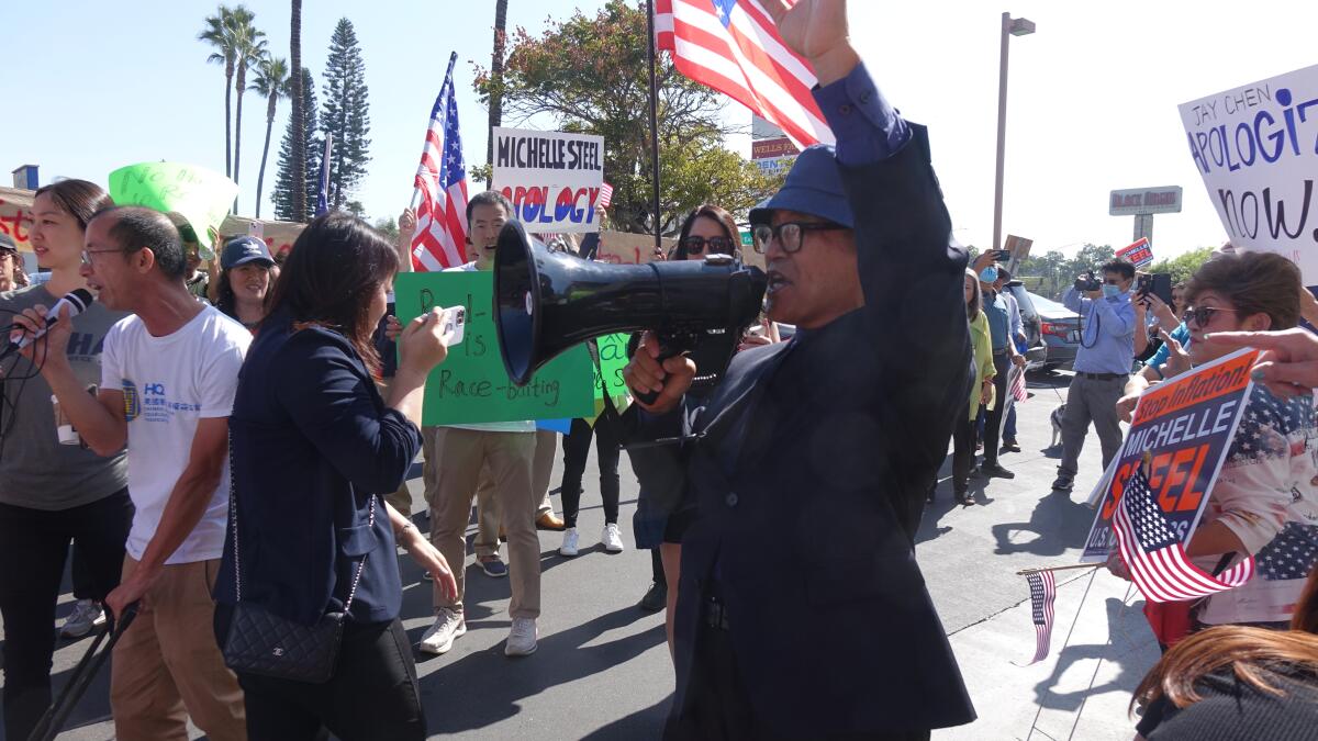 A supporter of Rep. Michelle Steel yells at congresswoman's campaign office in Buena Park on Saturday, October 29, 2022.