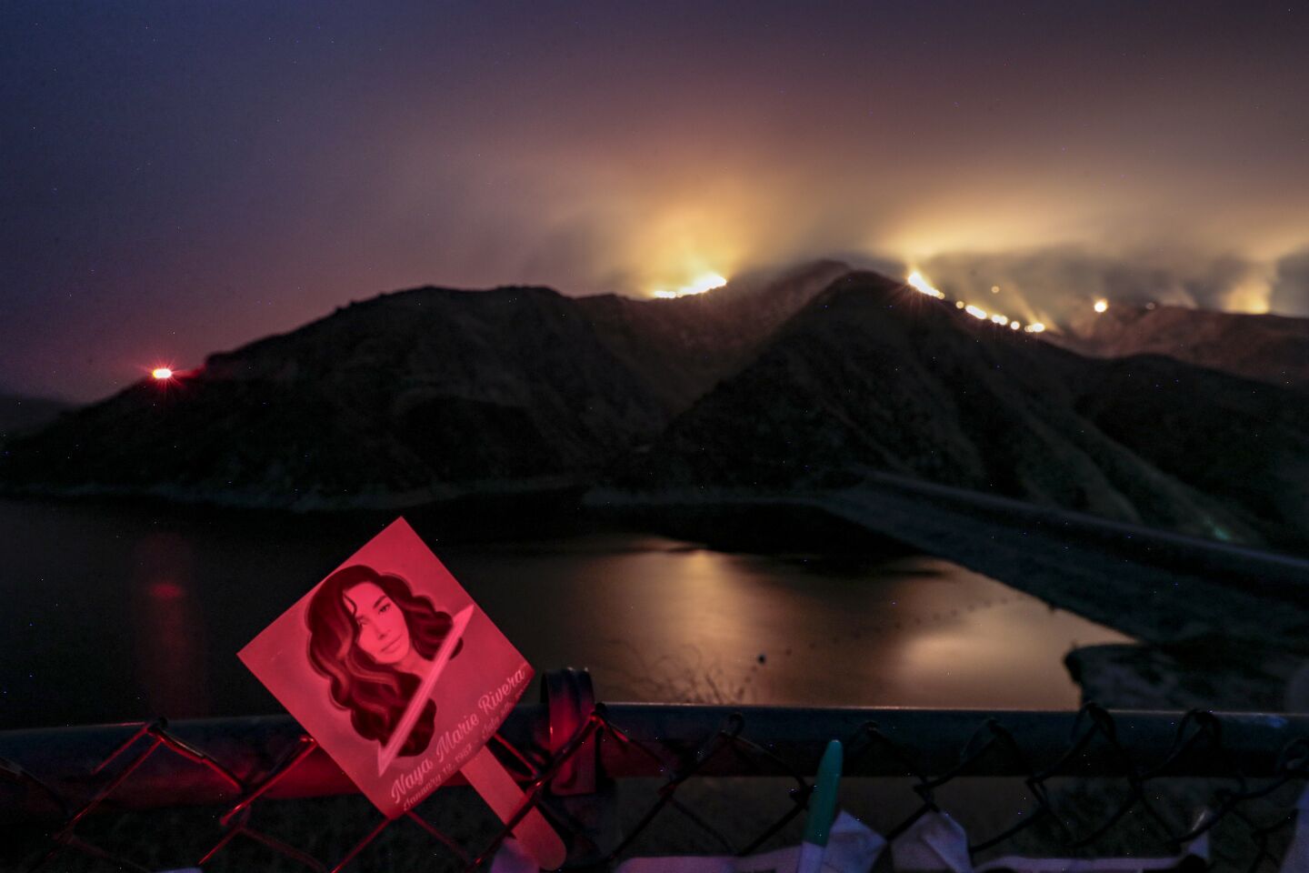The Holser Fire burns through the night just east of Lake Piru, where actress Naya Rivera died in mid-July.