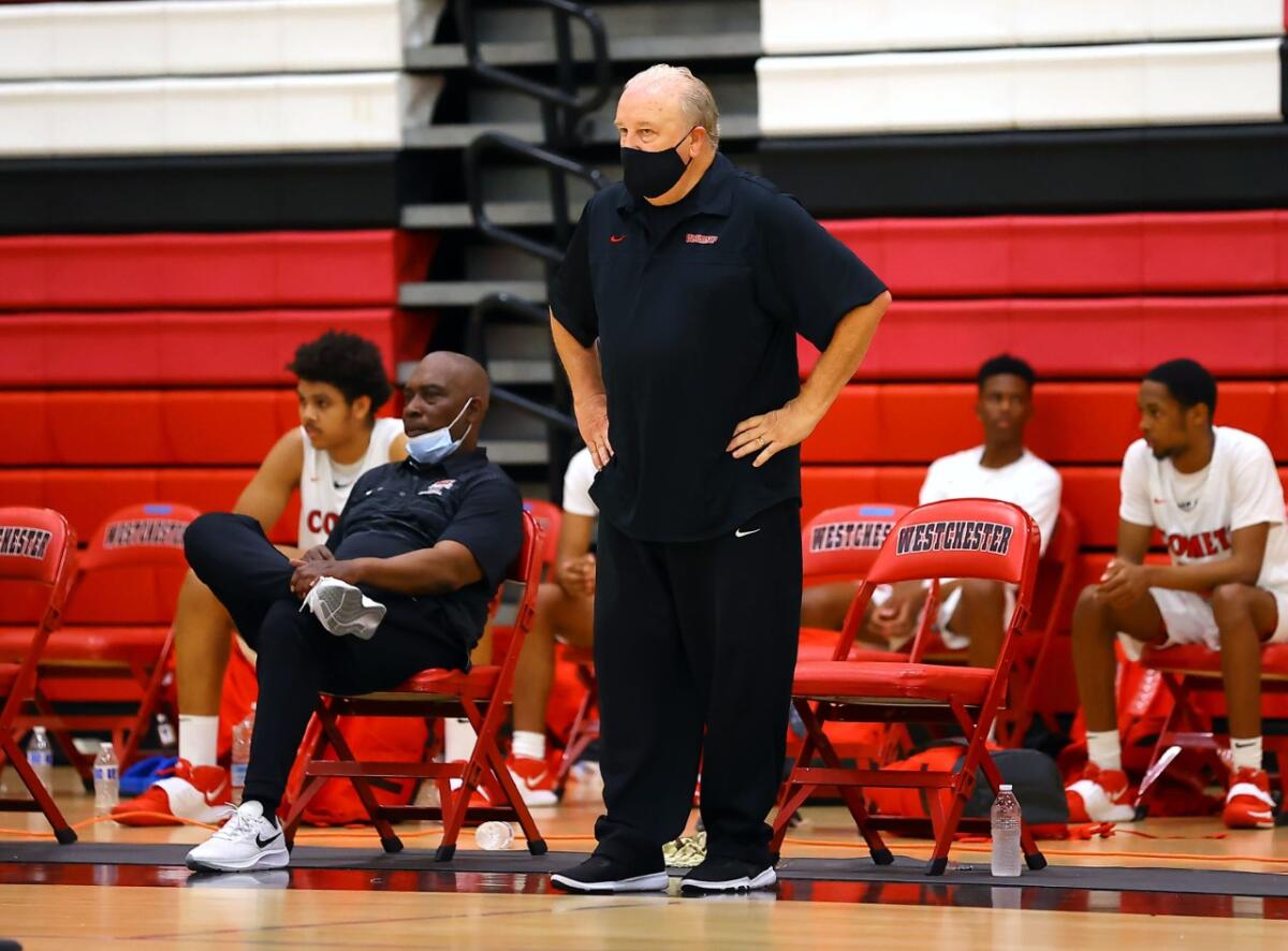 Westchester head basketball coach Ed Azzam directs his team from the sideline 