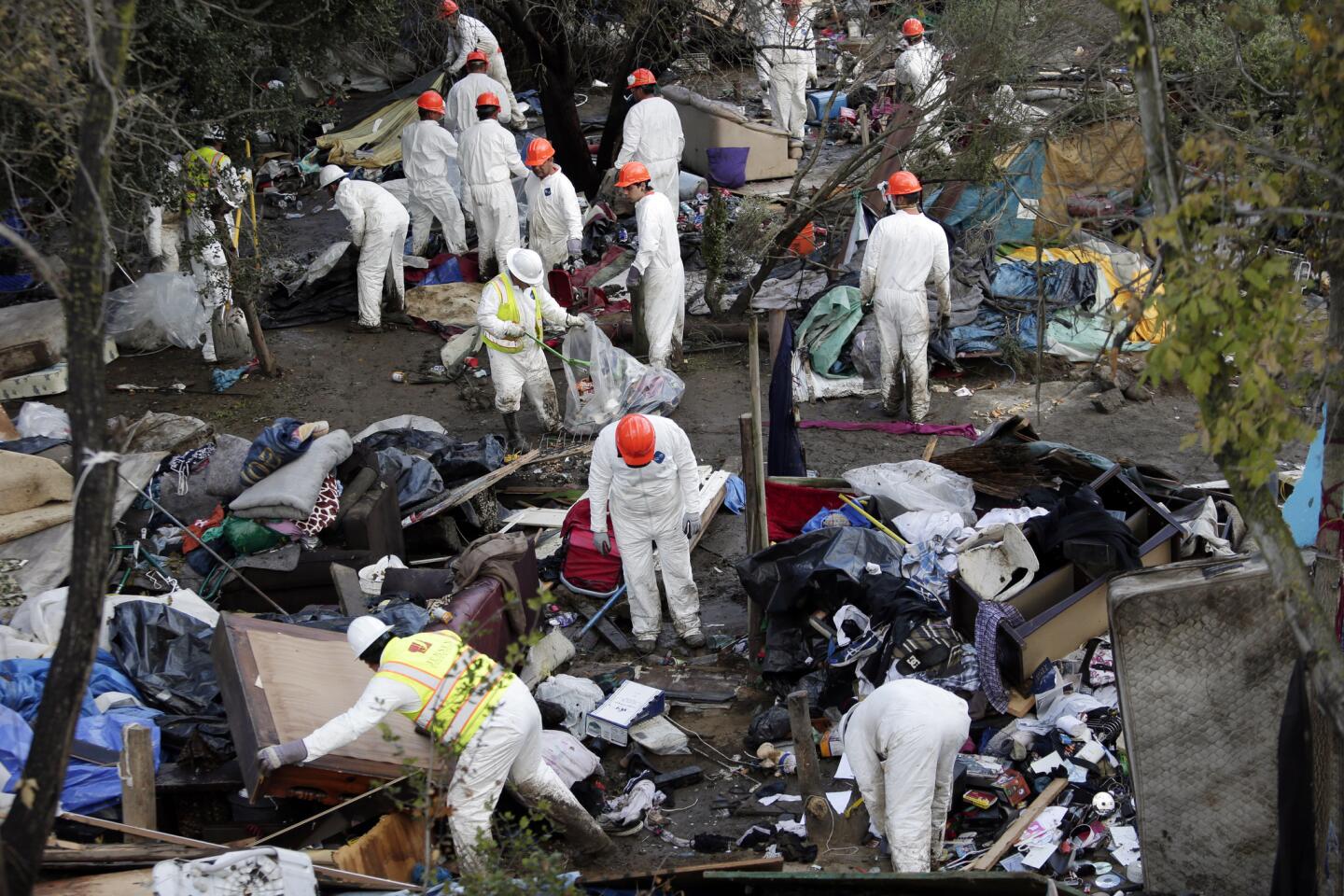 Crews begin the clean up process at a homeless encampment known as The Jungle in San Jose.