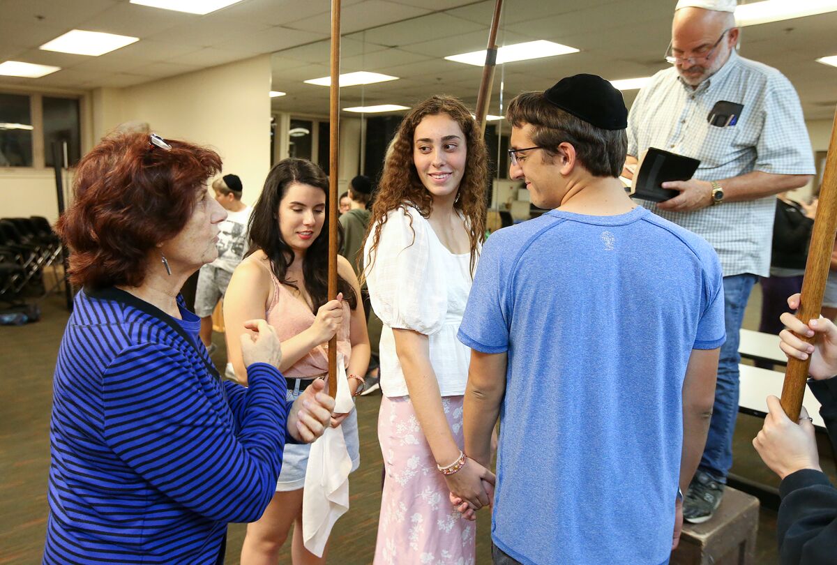 Donna Inglima, left, directs Sophia Gabal and Quinton Yusi during rehearsal for "I Never Saw Another Butterfly" at the Boys & Girls Club of Laguna Beach.