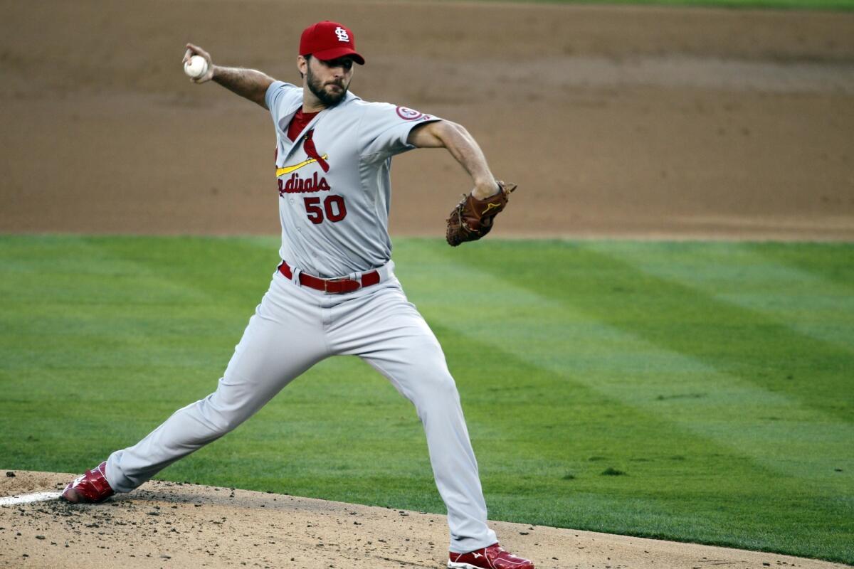 St. Louis starter Adam Wainwright delivers a pitch during the Cardinals' loss in Game 3 of the National League Championship Series to the Dodgers.