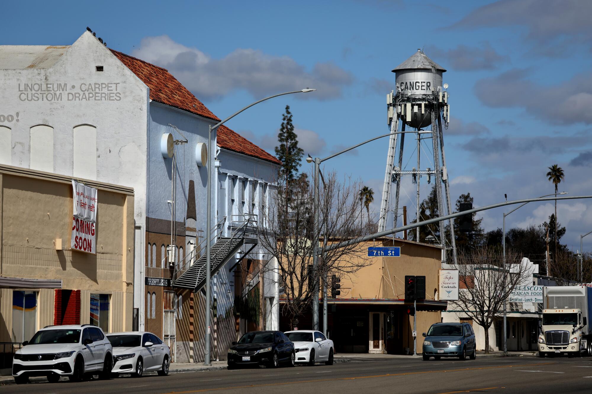 A water tower stands over downtown Sanger.