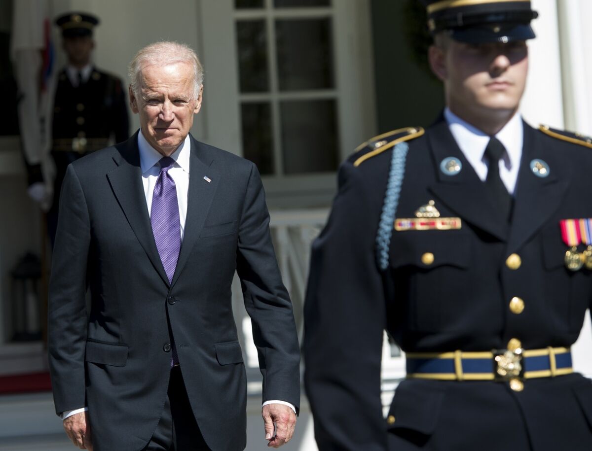 Vice President Joe Biden awaits the arrival of the South Korean president for lunch at Biden's official residence at the Naval Observatory in Washington on Thursday. An announcement on whether Biden will run for president is imminent, a top aide says.