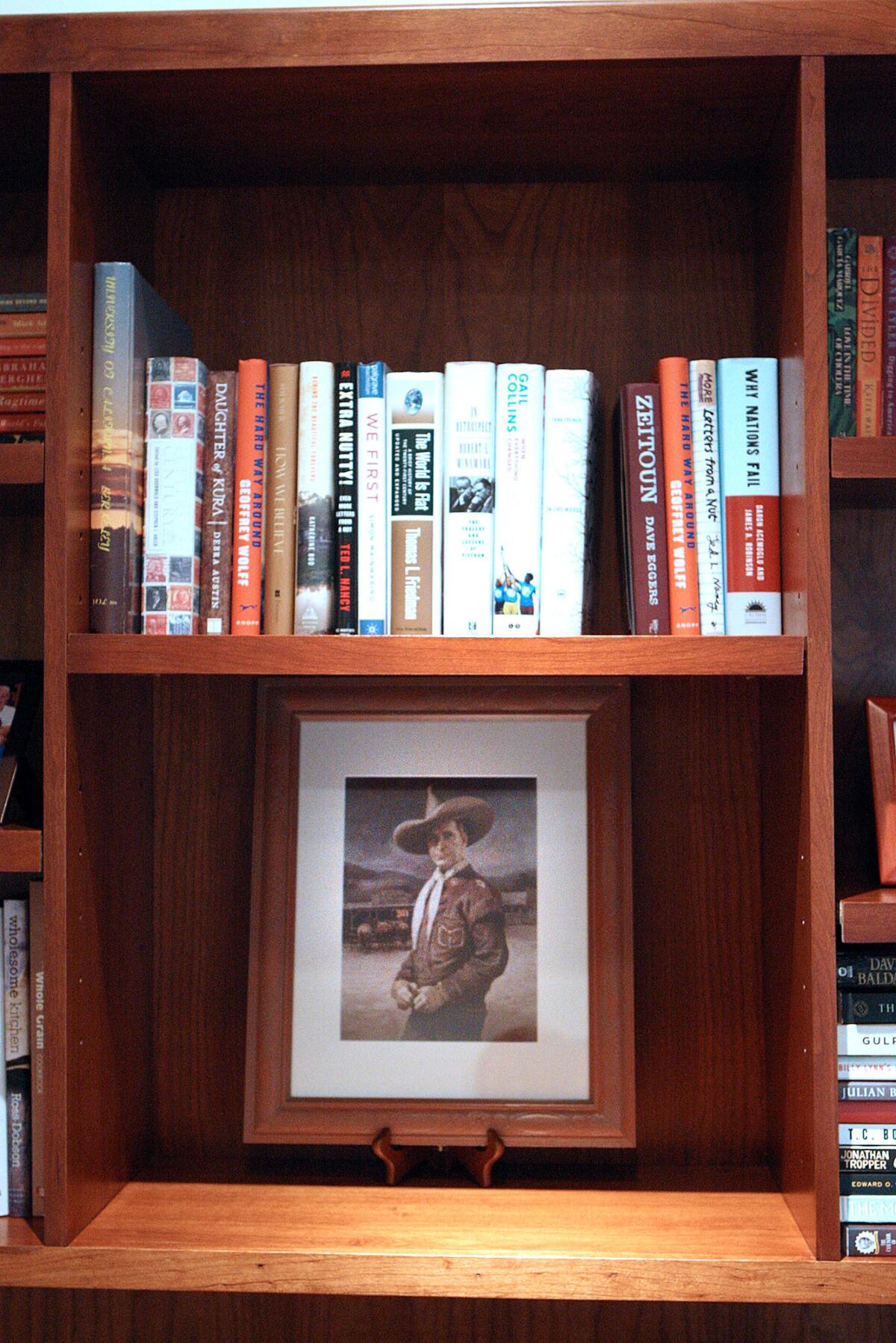 An image of cowboy actor Tim McCoy sits on a bookshelf of Janice Partyka and her husband Randy Hall, of La Canada Flintridge, in their home formerly owned by Inga Arvad and her husband Tim McCoy in La Canada Flintridge on Wednesday, October 23, 2013. Arvad had relationships with Adolf Hitler, and a young John F. Kennedy, and McCoy was a cowboy circus performer and an actor. Parkyka and her husband have become fascinated with their home's past and have done some historical digging to learn more about Arvad and McCoy.