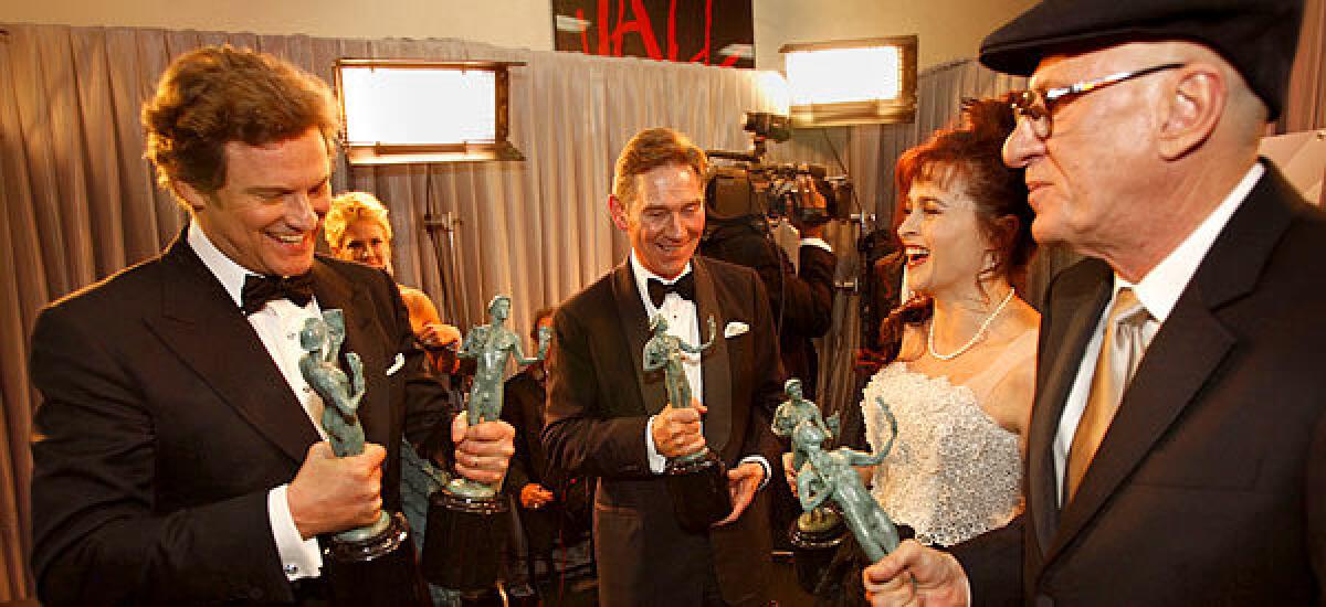 A night after winning top honors at the Directors Guild, "The King's Speech" picked up the trophy for outstanding cast at the 17th annual Screen Actors Guild Awards Sunday night, and Colin Firth nabbed lead actor honors for his performance in the film. Colin Firth, Anthony Andrews, Helena Bonham Carter and Geoffrey Rush admire their prizes backstage.