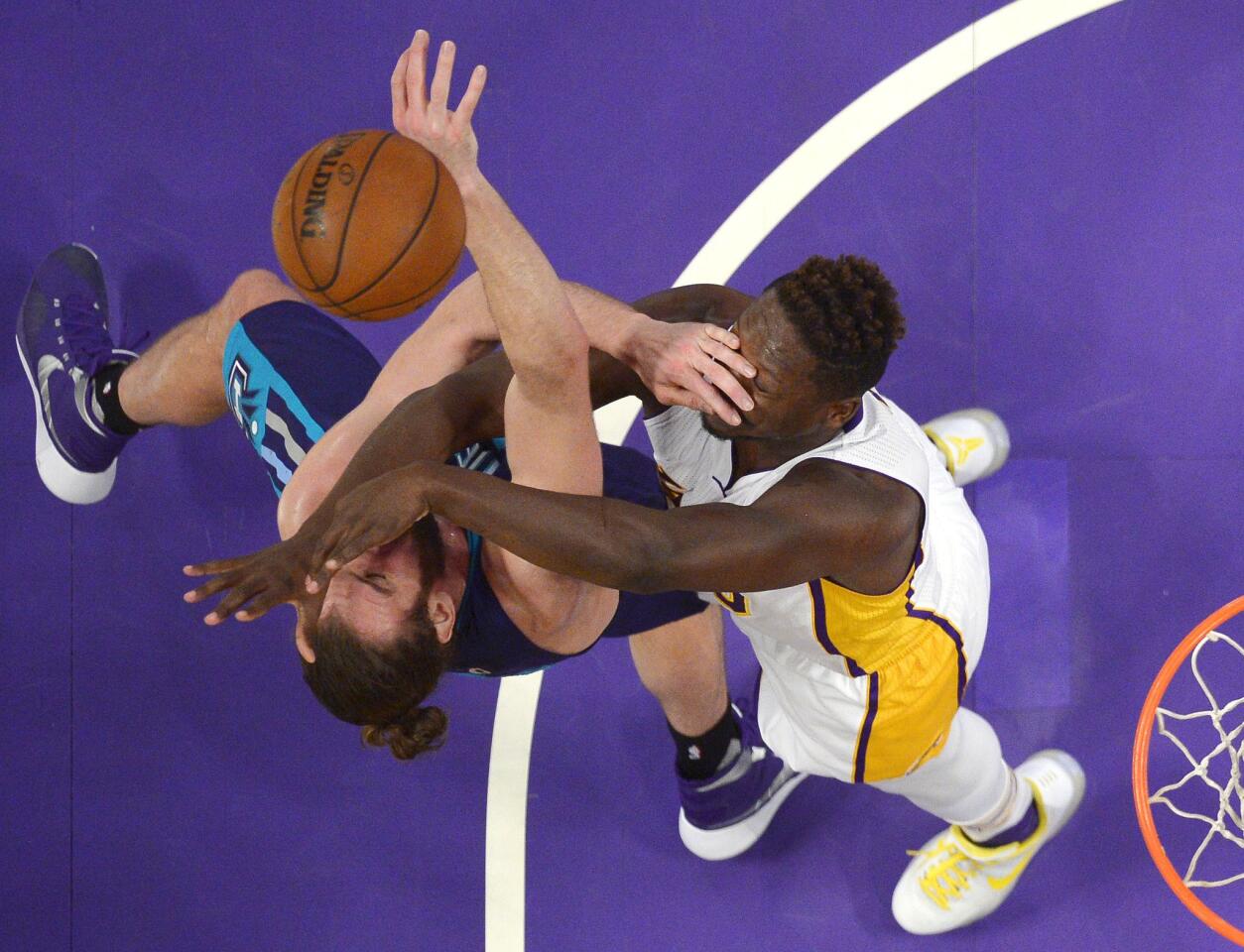 Hornets forward Spencer Hawes and Lakers forward Julius Randle battle for a rebound during a Jan 31 game at Staples Center.