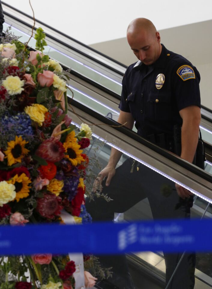 Flowers for slain TSA agent Gerardo Hernandez at LAX Terminal 3.