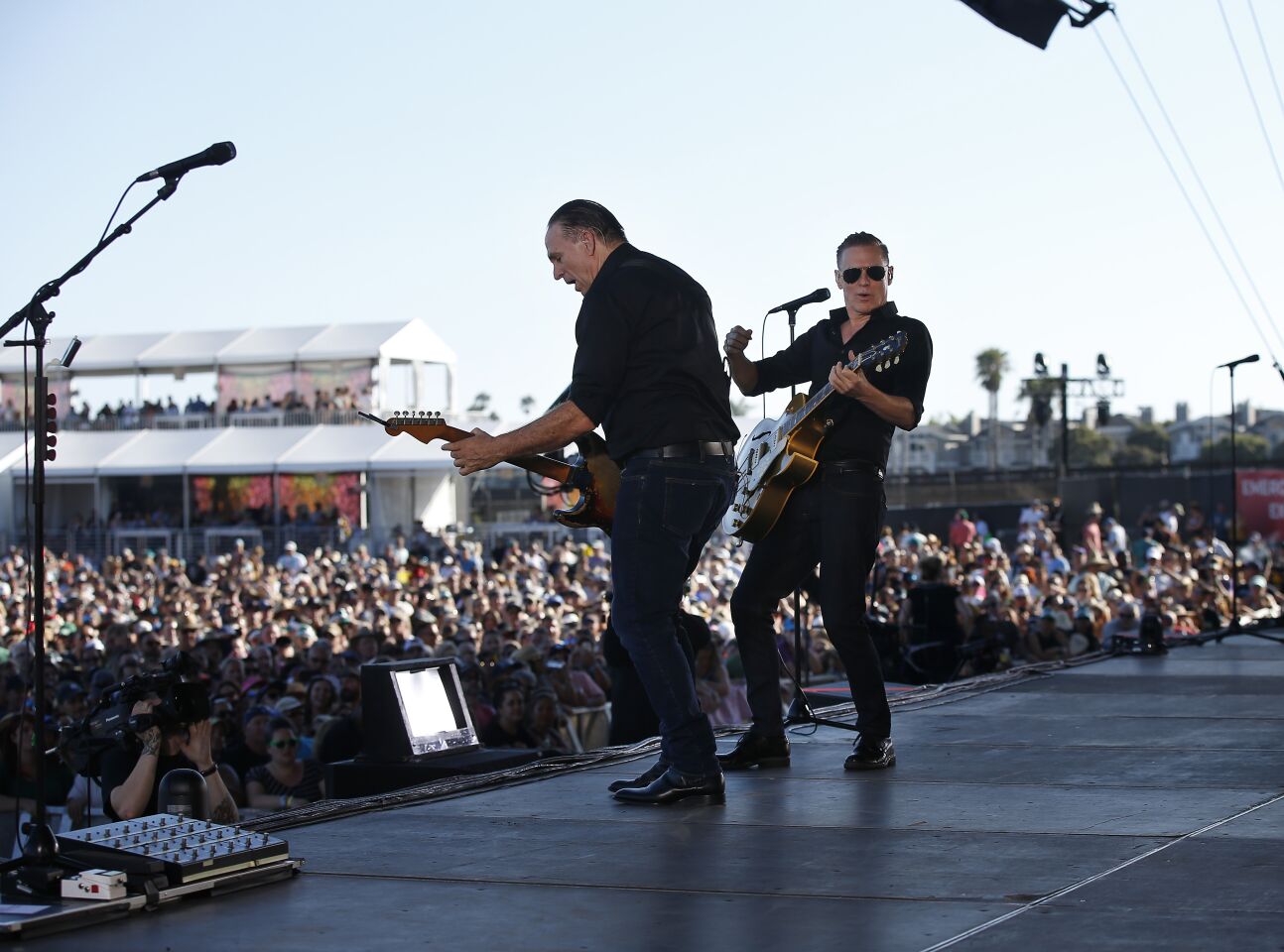 North County resident Keith Scott, left, plays guitar with Bryan Adams at the Sunset Cliffs stage at KAABOO Del Mar on Saturday, Sept. 14, 2019.