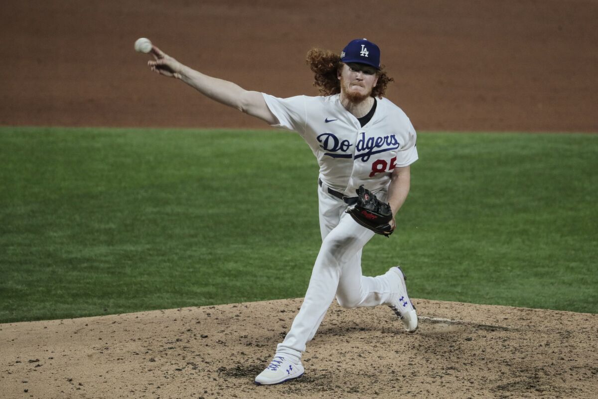 Dodgers starting pitcher Dustin May delivers against the San Diego Padres.