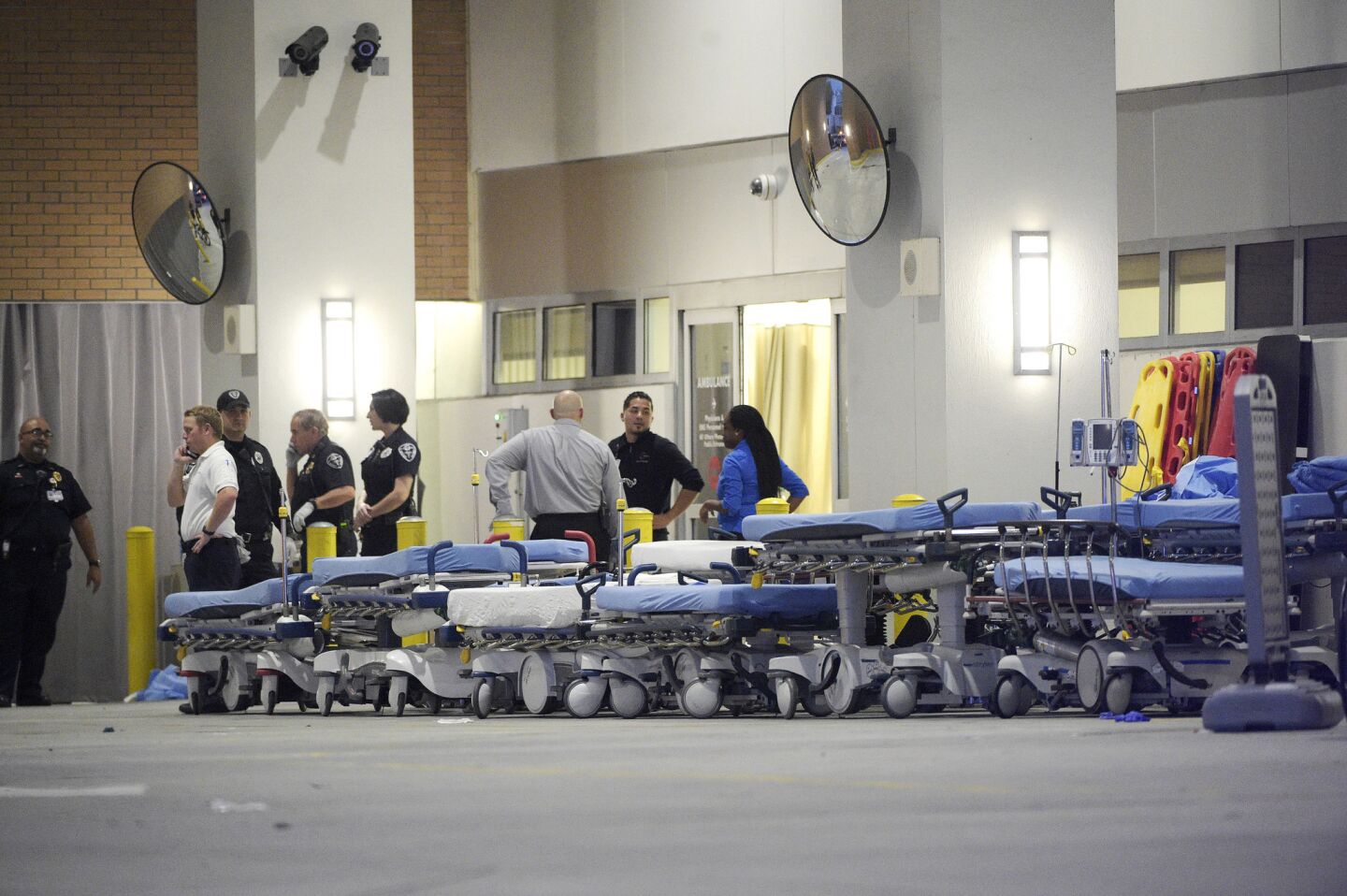 Emergency personnel at Orlando Regional Medical Center wait with stretchers for the arrival of victims from the fatal nightclub shooting.