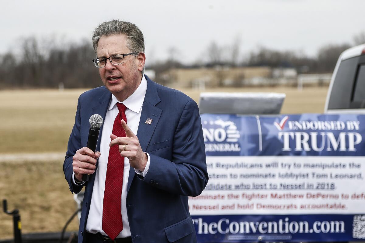 FILE - Matt DePerno, Republican candidate for Michigan Attorney General, speaks outside before a rally at the Michigan Stars Sports Center in Washington Township, Mich., on April 2, 2022. A special prosecutor in Michigan has been appointed to investigate whether DePerno and others should be criminally charged for their attempts to gain access to voting machines after the 2020 election. (Junfu Han/Detroit Free Press via AP, File)