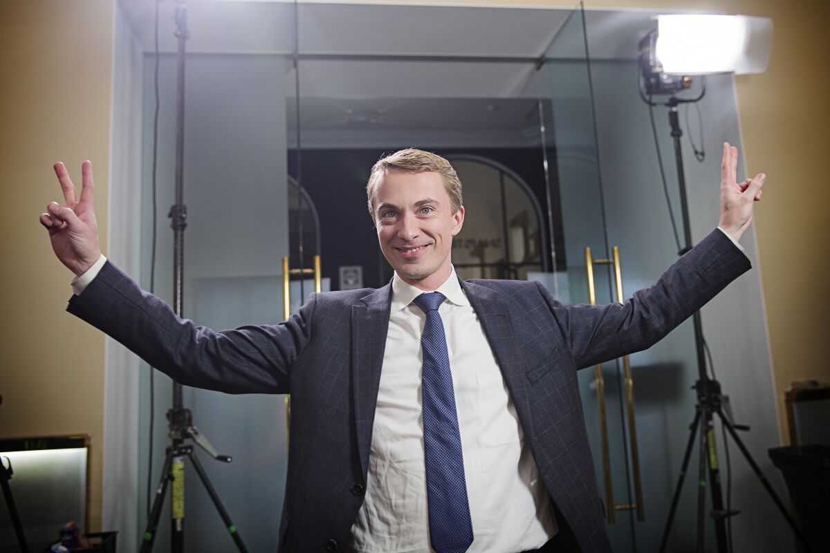FILE - In this file photo dated Thursday, Dec. 3, 2015, Morten Messerschmidt from Danish People's Party gestures to photographers in Copenhagen. Right-wing Danish lawmaker Messerschmidt, who was considered a rising star within the anti-immigration Danish People’s Party has been found guilty Friday Aug. 13, 2021, of misusing European Union funds worth dollars 15,667 US (13,281 euro). (Carsten Bundgaard/Polfoto via AP)