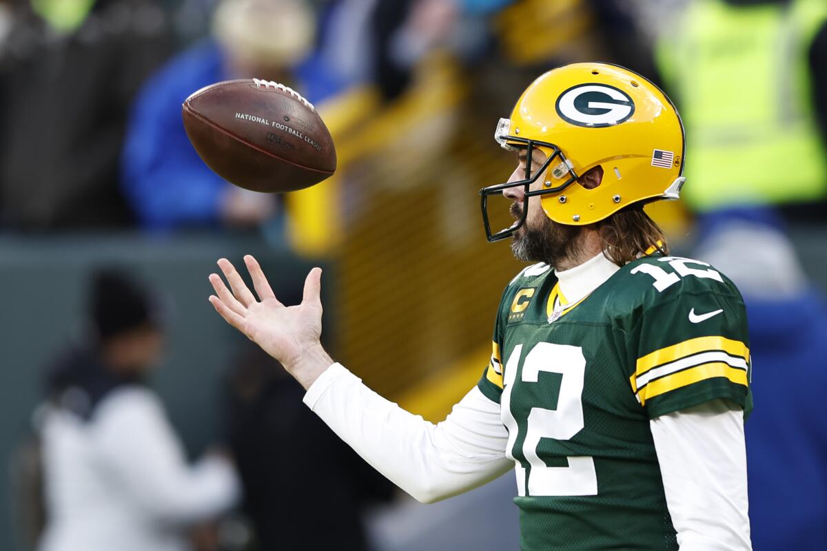 Green Bay Packers quarterback Aaron Rodgers warms up before a game against the Rams on Nov. 28.
