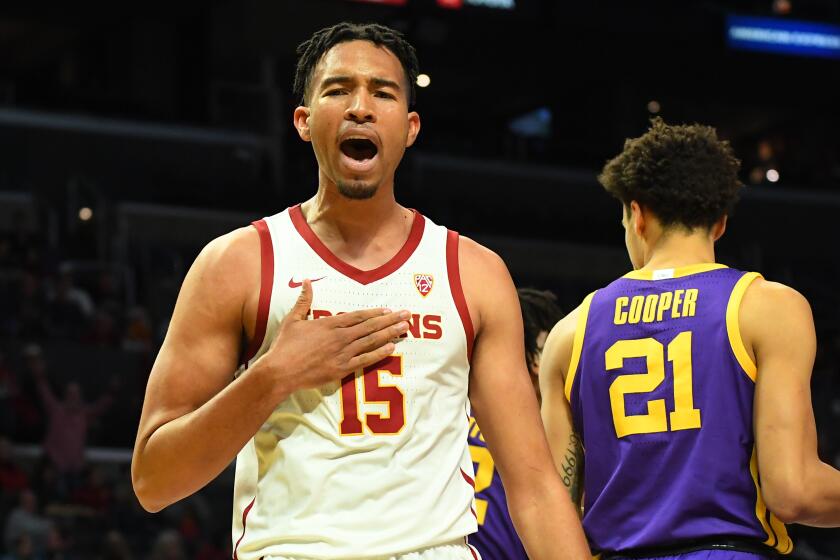 LOS ANGELES, CA - DECEMBER 21: Isaiah Mobley #15 of the USC Trojans reacts after he was fouled by Courtese Cooper #21 of the LSU Tigers as he made a basket and a foul in the first half of the game at Staples Center on December 21, 2019 in Los Angeles, California. (Photo by Jayne Kamin-Oncea/Getty Images)