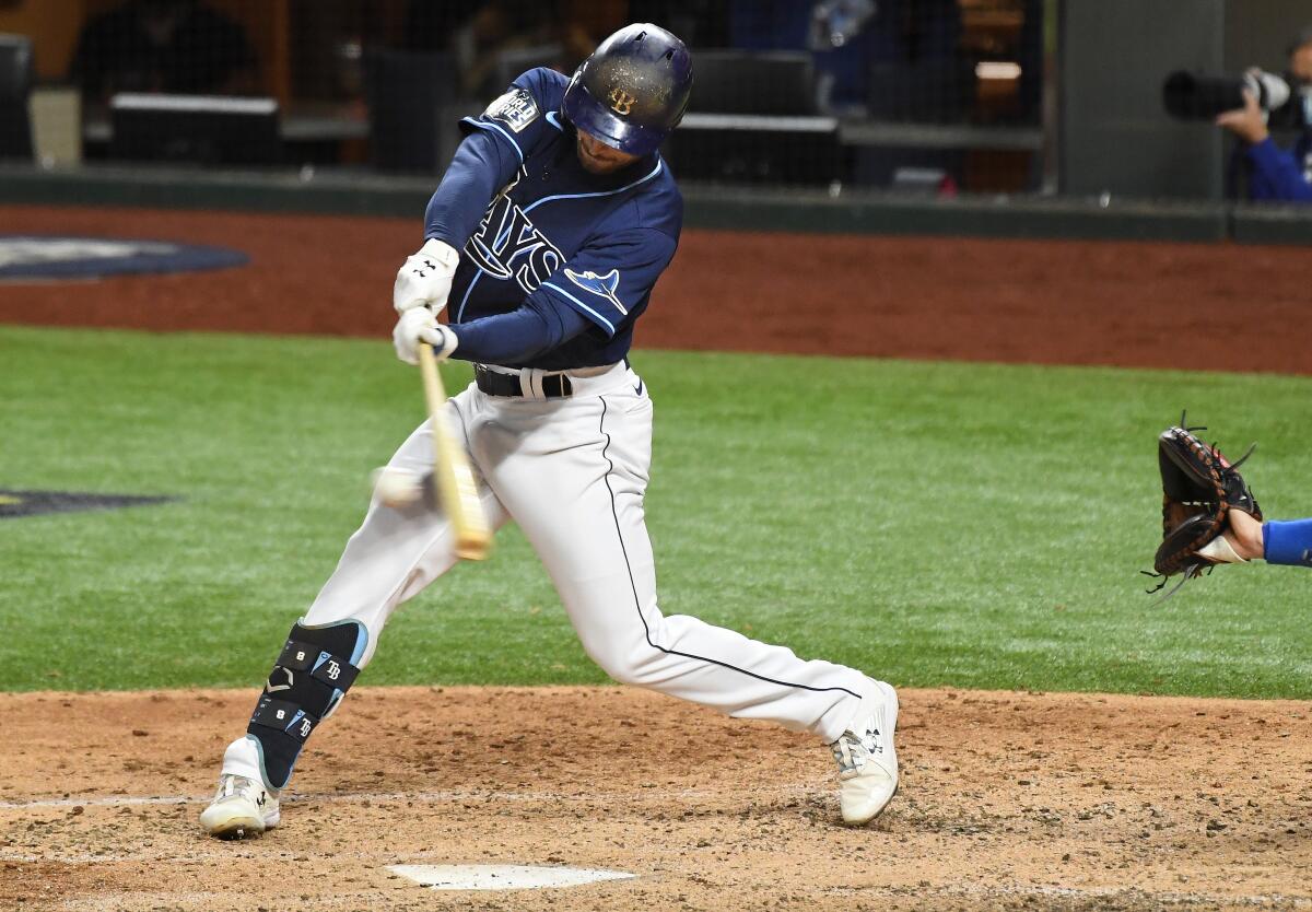 Tampa Bay's Brandon Lowe hits a three-run home run to give the Rays a 5-4 lead over the Dodgers.