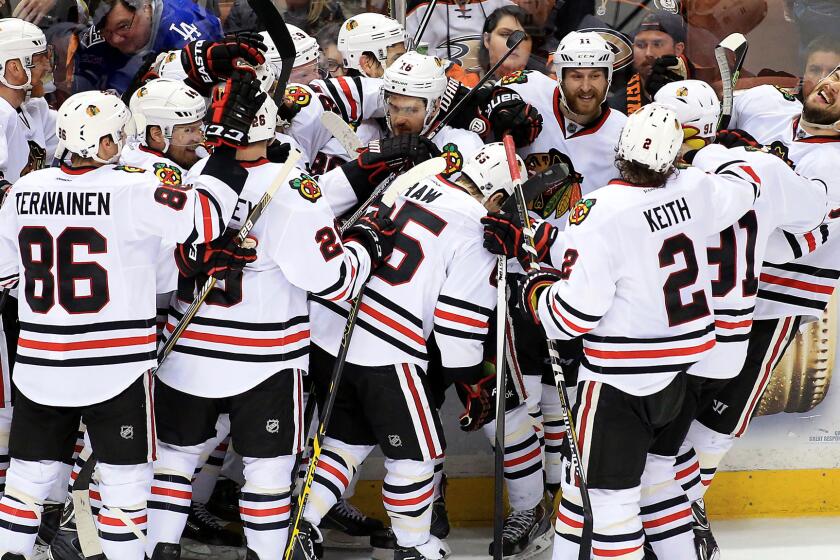 The Chicago Blackhawks celebrate following Marcus Kruger's winning goal in triple overtime of a 3-2 victory over the Ducks in Game 2 of the Western Conference finals at Honda Center on May 19, 2015.