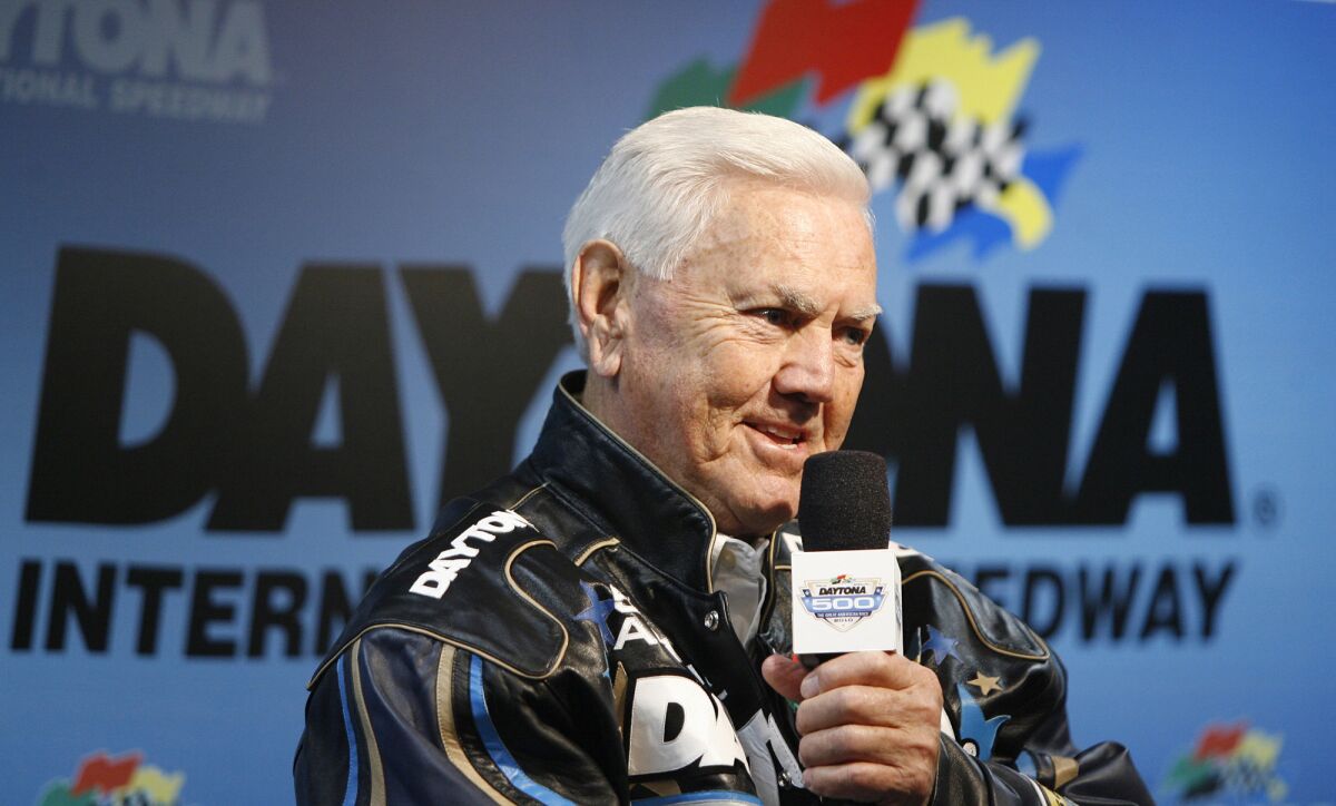 Racing legend Junior Johnson speaks to the media before the start of the Daytona 500 at Daytona International Speedway in Daytona Beach, Fla., on Feb. 14, 2010.