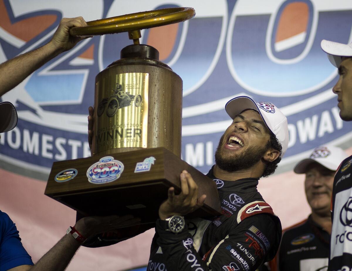 Darrell Wallace Jr. celebrates after winning the NASCAR Trucks series auto race in Homestead, Fla., on Nov. 14.