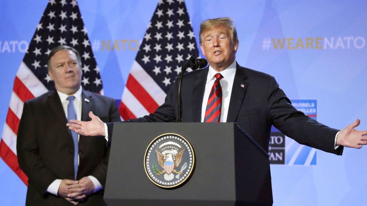 President Trump and Secretary of State Michael R. Pompeo during a news conference at the NATO summit in Brussels on July 12.