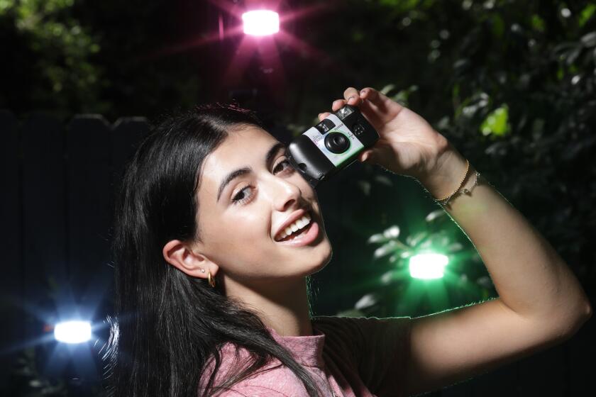 ENCINO, CA -- JULY 22, 2019: Kate Rozansky, 18, is among the younger folks who enjoy photographing with film cameras. With limited shots on a roll of film, she likes the more deliberate approach and also the surprise of not knowing what she's shot until the film's processed. (Myung J. Chun / Los Angeles Times)