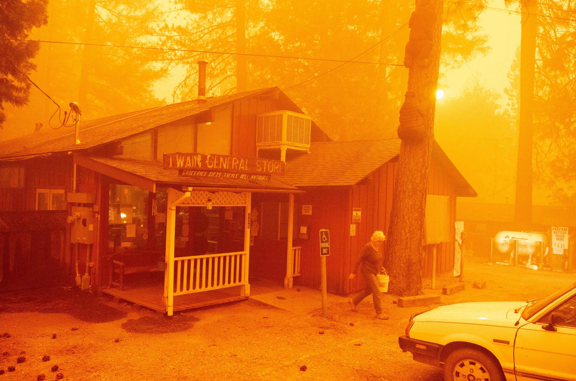 Twain General Store manager Pamela Aylen gathers supplies to take back to her home.