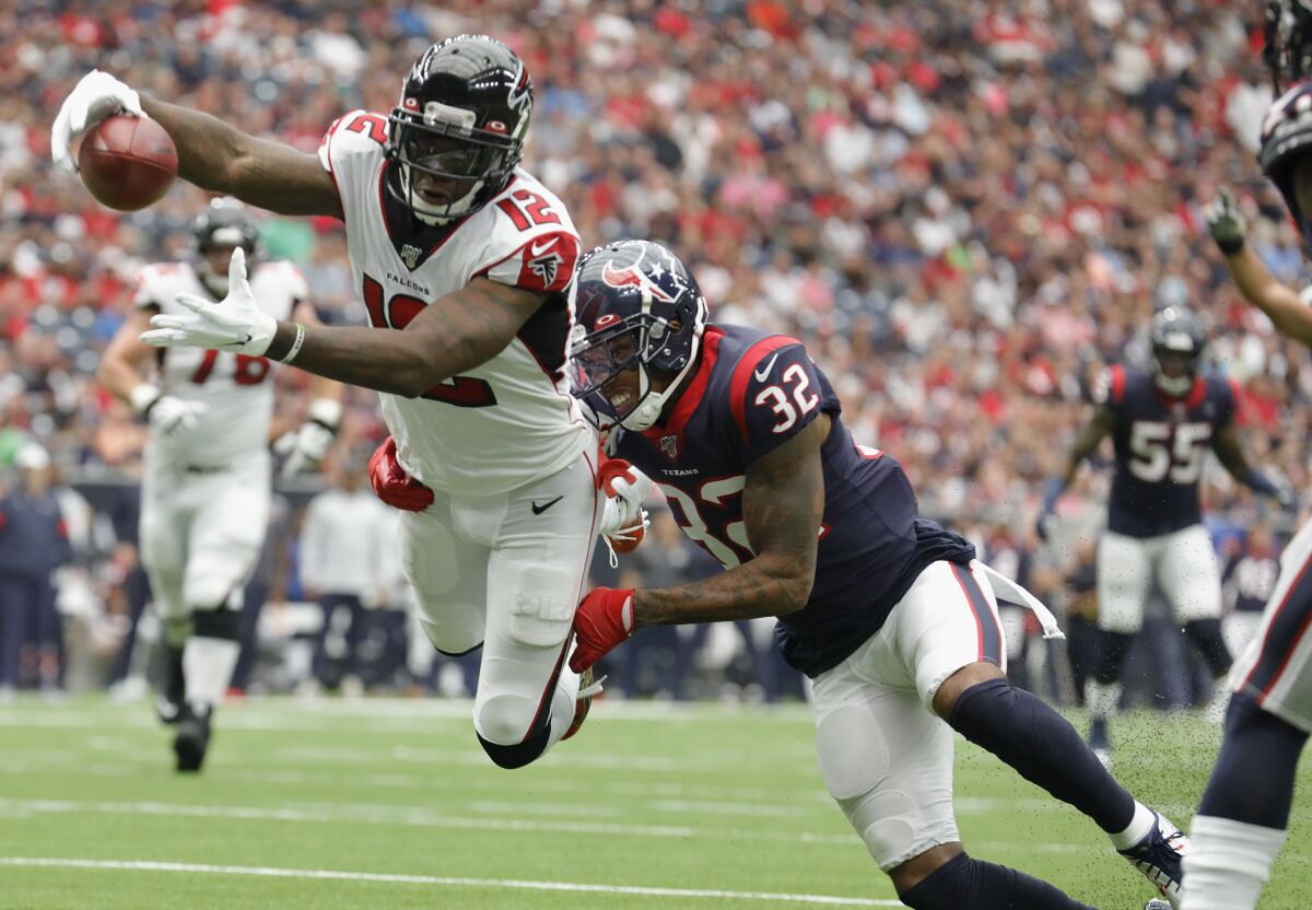 Atlanta Falcons receiver Mohamed Sanu dives for a touchdown while defended by Houston Texans' Lonnie Johnson on Oct. 6.