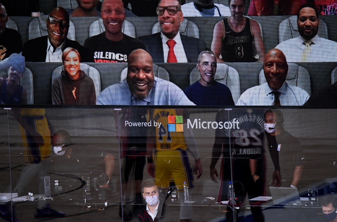 Virtual fans including Robin Roberts, Shaquille O"Neil and former president Barrack Obama watch Game 1 from the videoboard.