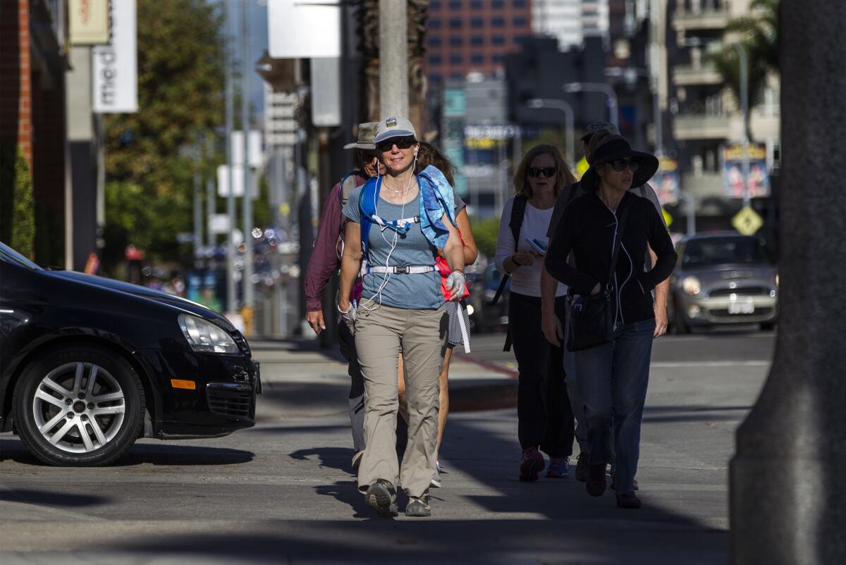 Sierra Club members are 13 miles into their annual 16-mile walk from Wilshire Boulevard and Figueroa Street in downtown Los Angeles to Ocean Avenue in Santa Monica.