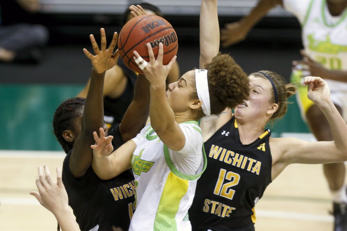 South Florida guard Elena Tsineke (5) goes for the basket during the first half of an NCAA college basketball game against Wichita State, Wednesday, Jan. 6, 2021 in Tampa, Fla. (Ivy Ceballo/Tampa Bay Times via AP)
