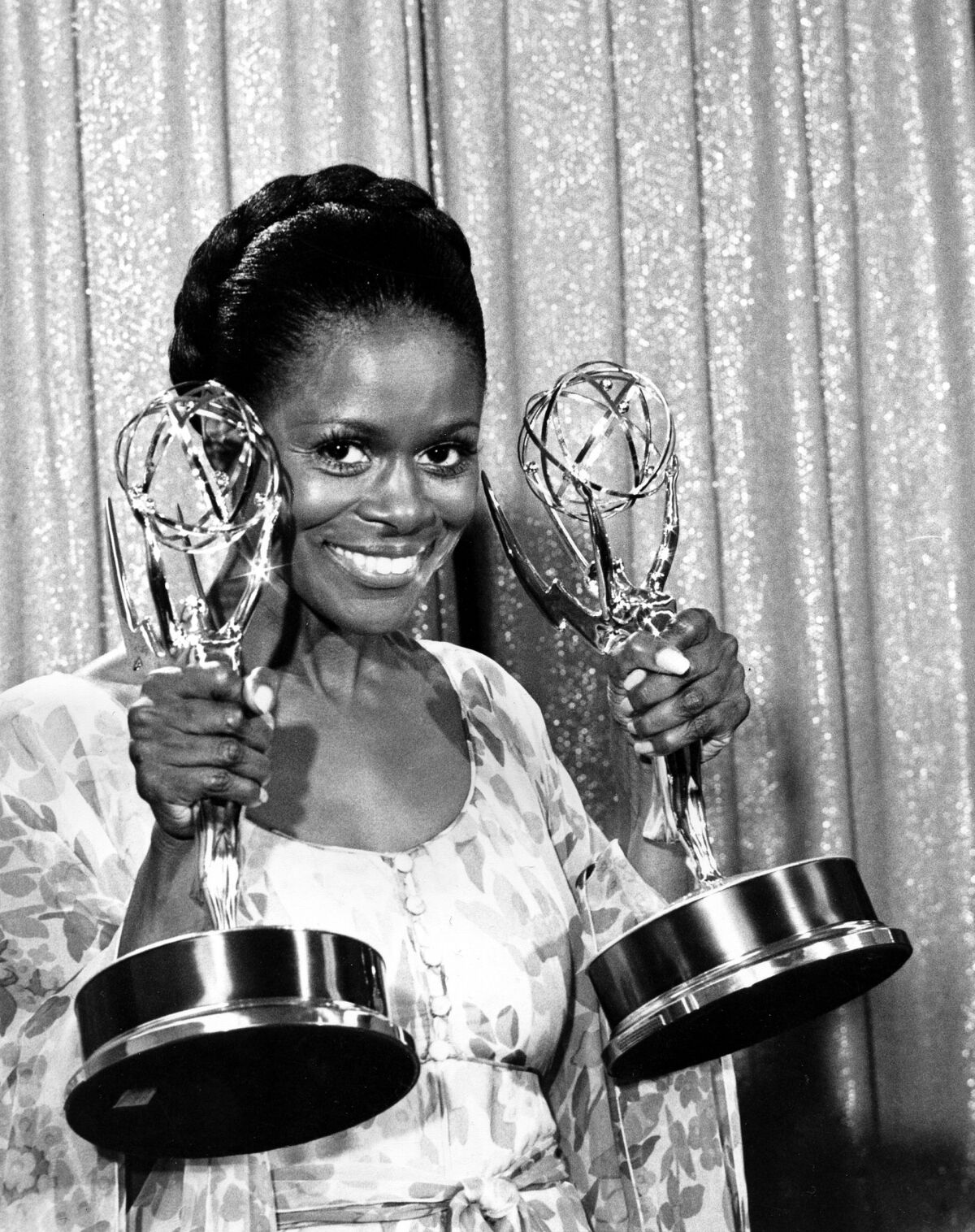 Cicely Tyson holding two Emmy Awards
