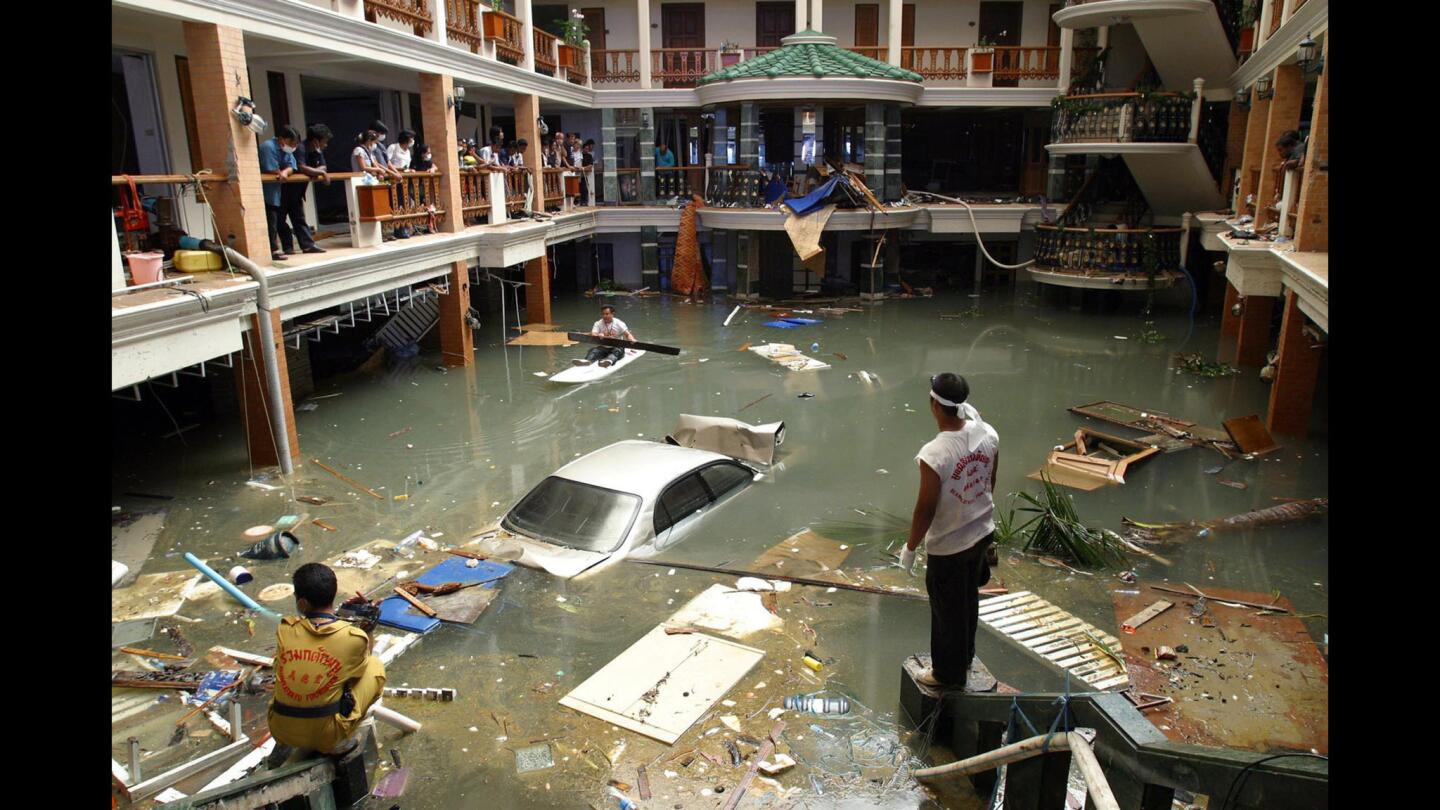 On Dec. 28, 2004, a rescue and cleanup crew surveys a flooded lobby at the Seapearl Beach Hotel along Patong Beach on Phuket Island in Thailand.