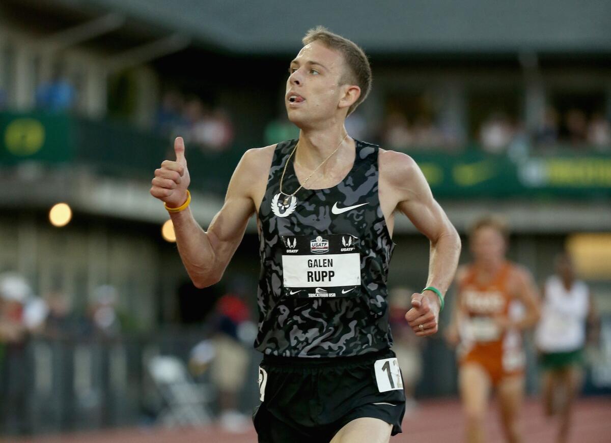 Galen Rupp celebrates winning the 10,000 meters Thursday at the U.S. track and field championships in Eugene, Ore.