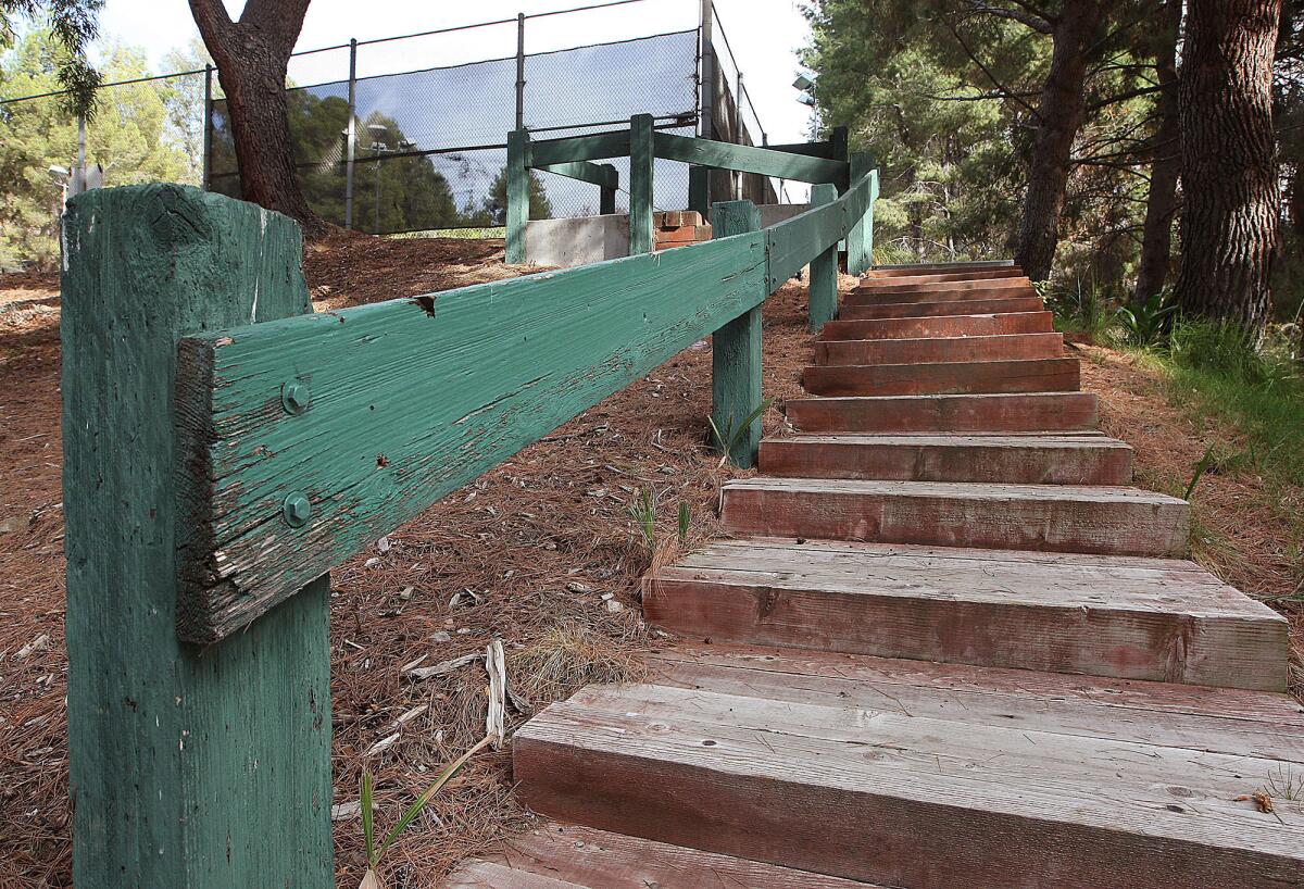 The wooden steps and rail that lead to the tennis courts at Brace Canyon Park are part of the millions dollars worth of infrastructure needs at city parks and facilities in Burbank. Photographed on Tuesday, Nov. 19, 2013.