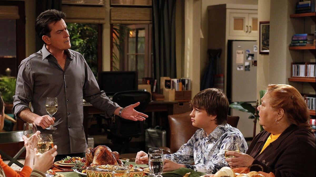 Charlie Sheen, left, Angus T. Jones and Conchata Ferrell in "Two and a Half Men."