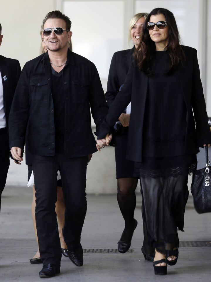 Bono and wife Alison Hewson arrive at Venice's Marco Polo Airport ahead of George Clooney's wedding.