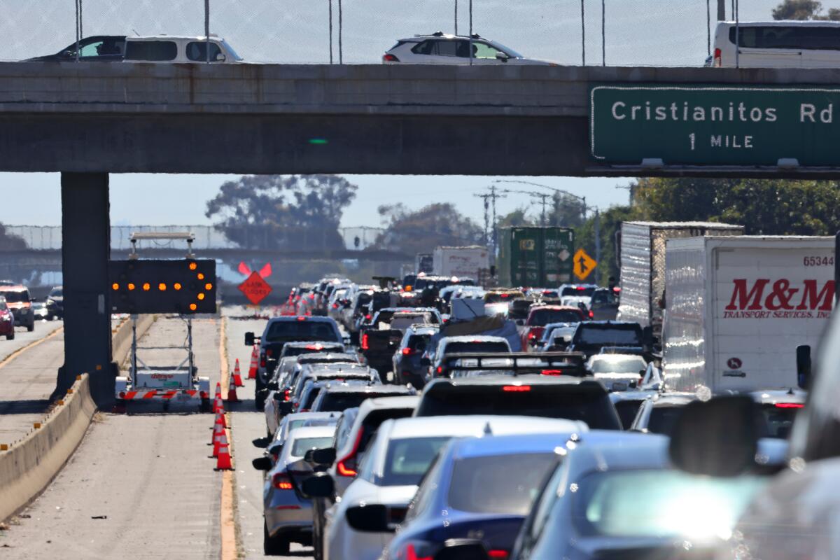 Long backup of vehicles on a road.