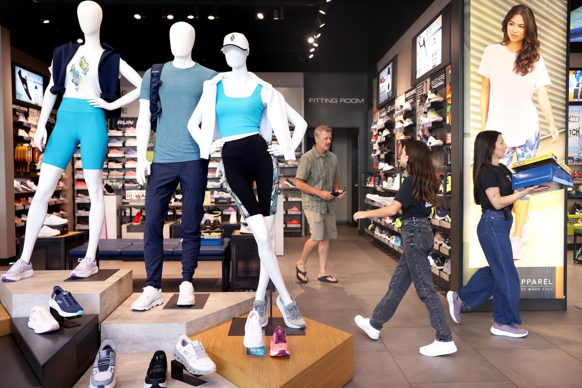 Apparel and shoes are displayed at the Skechers store.